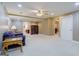 Finished basement with plush carpeting, neutral paint, a ceiling fan, and space for customizable decor at 1621 White Oak Cv, Loganville, GA 30052