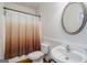 This bathroom has neutral colors and features a shower with a modern shower curtain at 1621 White Oak Cv, Loganville, GA 30052