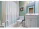 Cozy bathroom with tub/shower combination and a white vanity with a modern sink at 1621 White Oak Cv, Loganville, GA 30052