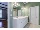 The bathroom features double sinks, a large mirror, and plenty of counter space at 1621 White Oak Cv, Loganville, GA 30052