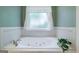 This bathroom features a large tub with jets, perfect for soaking and relaxing at 1621 White Oak Cv, Loganville, GA 30052