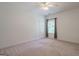 This bedroom is spacious with a ceiling fan and a window that provides ample lighting at 1621 White Oak Cv, Loganville, GA 30052