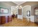 Spacious dining room featuring hardwood floors, elegant chandelier, and classic molding details at 1621 White Oak Cv, Loganville, GA 30052