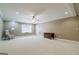 Living room featuring a window seat with a view and ample natural light, creating a cozy atmosphere at 1621 White Oak Cv, Loganville, GA 30052