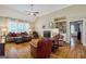 Spacious living room featuring a cozy fireplace, built-in shelving, and natural light at 1621 White Oak Cv, Loganville, GA 30052