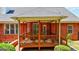 Covered patio offers a space for outdoor relaxation and entertaining, with views of the backyard at 1621 White Oak Cv, Loganville, GA 30052