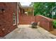 Brick patio with table and chairs offers a space for outdoor dining and entertaining at 1621 White Oak Cv, Loganville, GA 30052
