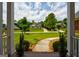 Picturesque view from the porch, showcasing the lush landscaping and surrounding homes at 1621 White Oak Cv, Loganville, GA 30052