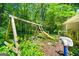 Backyard featuring play equipment, with a swing set, slide, and basketball hoop at 2257 Chestnut Log Loop, Lithia Springs, GA 30122