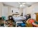 Spacious bedroom with hardwood floors, ceiling fan, and natural light from the window at 2257 Chestnut Log Loop, Lithia Springs, GA 30122