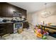 Kitchen with dark cabinets and stainless steel appliances, needs TLC at 2257 Chestnut Log Loop, Lithia Springs, GA 30122
