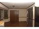 Eat in kitchen features stainless steel refrigerator, hardwood floors, and natural light at 3857 Pointers Sw Way, Conyers, GA 30094