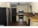 Kitchen featuring stainless steel appliances, light wood countertops, and neutral cabinets at 3857 Pointers Sw Way, Conyers, GA 30094