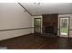Bright living room with vaulted ceiling, brick fireplace, and hardwood floors at 3857 Pointers Sw Way, Conyers, GA 30094