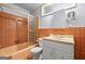 A bathroom that features brown tile, a sink, and a standard toilet at 1283 Bramble Ne Rd, Atlanta, GA 30329