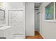 This bathroom features a shower, storage, and a window at 1283 Bramble Ne Rd, Atlanta, GA 30329