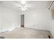 A empty bedroom featuring a ceiling fan and window, primed for design and remodel at 1283 Bramble Ne Rd, Atlanta, GA 30329