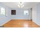 This bedroom has hardwood floors and two windows to let in natural light at 1283 Bramble Ne Rd, Atlanta, GA 30329