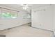 An empty bedroom featuring a ceiling fan and window, primed for design and remodel at 1283 Bramble Ne Rd, Atlanta, GA 30329