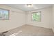 A well-lit bedroom featuring two windows and white walls at 1283 Bramble Ne Rd, Atlanta, GA 30329