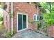 Exterior view of a brick home with a sliding glass door at 1283 Bramble Ne Rd, Atlanta, GA 30329