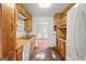 Galley kitchen featuring wooden cabinets and vintage appliances ready for renovation and upgrades at 1283 Bramble Ne Rd, Atlanta, GA 30329