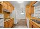 Galley kitchen showing double sink, and appliances, ready for remodeling project at 1283 Bramble Ne Rd, Atlanta, GA 30329