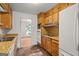 Galley kitchen with wood cabinets, and appliances, ready for remodel and redesign at 1283 Bramble Ne Rd, Atlanta, GA 30329