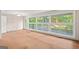 Bright living room featuring large windows and a door to the back of the home at 1283 Bramble Ne Rd, Atlanta, GA 30329