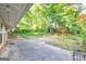Backyard patio surrounded by green trees and foliage at 1283 Bramble Ne Rd, Atlanta, GA 30329