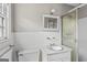 Bright bathroom features a stand up shower and white tiled walls at 315 Burke Cir, Mcdonough, GA 30253