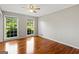 Bright bedroom with hardwood floors and large windows offering lots of natural light at 315 Burke Cir, Mcdonough, GA 30253