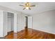 Bedroom with hardwood floors and closet with louvered doors at 315 Burke Cir, Mcdonough, GA 30253