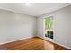 Cozy bedroom with hardwood floors, natural light, and neutral paint tones at 315 Burke Cir, Mcdonough, GA 30253