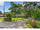 Charming ranch home with mature trees, lush lawn, and a long driveway leading to the house at 315 Burke Cir, Mcdonough, GA 30253
