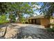 Spacious open garage showcasing a brick exterior, lush landscaping, and ample parking space at 315 Burke Cir, Mcdonough, GA 30253