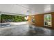 Large open garage space with brick walls and view to exterior yard at 315 Burke Cir, Mcdonough, GA 30253