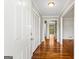 Inviting hallway with gleaming hardwood floors and neutral paint, offering a warm welcome at 315 Burke Cir, Mcdonough, GA 30253