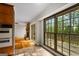 Bright kitchen area with large windows, access to deck, and view to the living room at 315 Burke Cir, Mcdonough, GA 30253