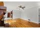 A spacious living room featuring hardwood floors, fireplace, and direct kitchen access at 315 Burke Cir, Mcdonough, GA 30253