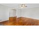 Spacious living room with hardwood floors, a ceiling fan, and easy access to other rooms at 315 Burke Cir, Mcdonough, GA 30253