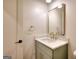 Powder room boasts modern vanity with marble top, gold faucet, and stylish fixtures at 1947 Clark Dr, Tucker, GA 30084