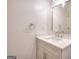Bathroom with white sink and vanity, including a modern, square mirror at 1947 Clark Dr, Tucker, GA 30084