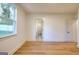 Empty bedroom with hardwood flooring, window, and plenty of natural light at 1947 Clark Dr, Tucker, GA 30084