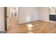 A bedroom features hardwood floors, white walls, and bathroom doorways at 1947 Clark Dr, Tucker, GA 30084