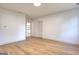Large empty bedroom showcasing hardwood floors, white walls, and modern fixtures at 1947 Clark Dr, Tucker, GA 30084