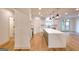Bright, modern kitchen with a large island, stainless steel appliances, and hardwood floors at 1947 Clark Dr, Tucker, GA 30084