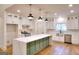 Stylish kitchen with stainless appliances, a center island, quartz counters, and modern pendant lighting at 1947 Clark Dr, Tucker, GA 30084