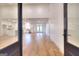 Open concept living room and kitchen with hardwood floors, stainless steel appliances, and large windows at 1947 Clark Dr, Tucker, GA 30084