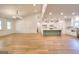 Bright living room featuring hardwood floors, recessed lighting, and open concept design to the kitchen and dining area at 1947 Clark Dr, Tucker, GA 30084